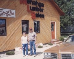Janet and Ron in front of our lbr. yard
